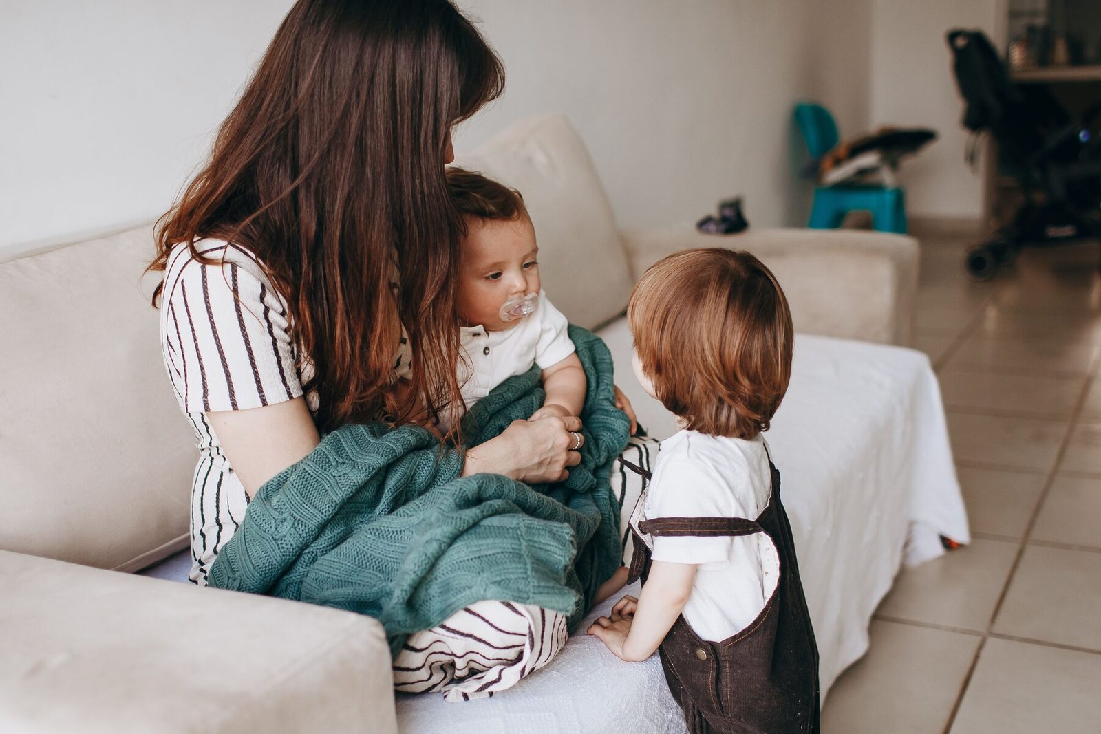 Illustrative photograph of a parent and children at home. Not an Ashpoint Group client — see our Privacy Policy.